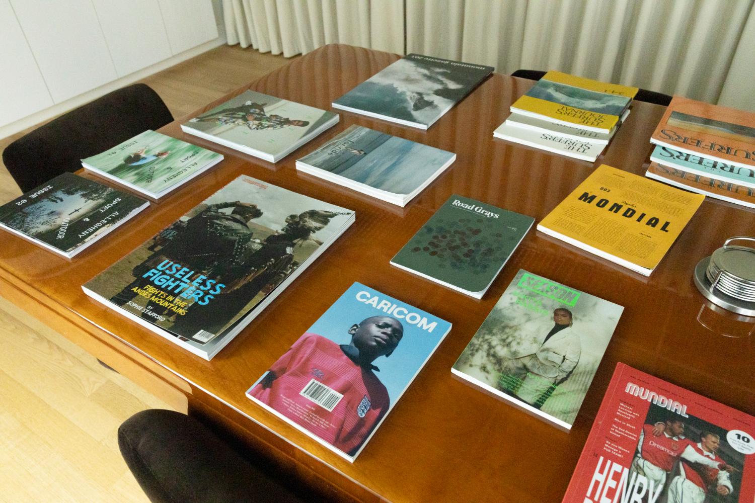 Magazines laid out on a table in a room